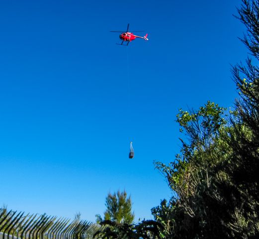 ZK-HBS — - One of Helipros bright red H369s carrying out some long line lifting for a radio contractor up on Mt Edgecumbe back in April 2010.