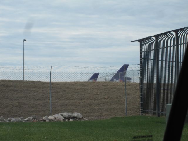 McDonnell Douglas DC-10 (N385FE) - Two FedEx Planes (Boeing MD-10-10F N385FE in the front, Airbus A300B4-622 N716FD in the back) are both relaxed at R.D.U. on New Years Eve of 2012. This plane came in as FDX785 from MEM and will take off as FDX1249 to MEM.