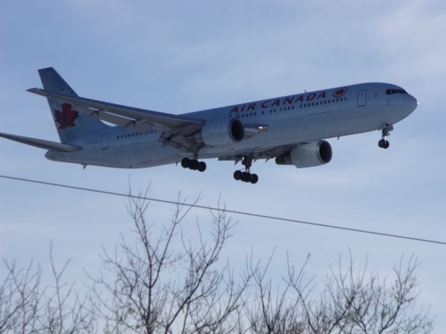 BOEING 767-300 (C-FOCA) - landing on #32, tree top level. taken by my 11 yr.old son