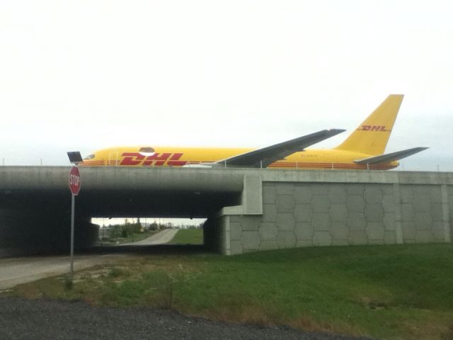 BOEING 767-300 — - Landed on 18C and KCVG and was on taxiway to the DHL terminal (in background)