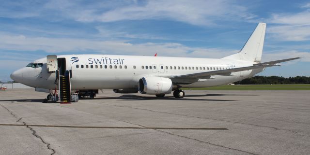 BOEING 737-400 (N313XA) - Swift Airs Boeing 737-484 on the ramp at Northwest Alabama Regional Airport, Muscle Shoals, AL - September 29, 2018. This jet is a previous Xtra Airways aircraft. N313XA carried the University of North Alabama Lion football team to Raleigh-Durham, North Carolina for their game against Campbell University.