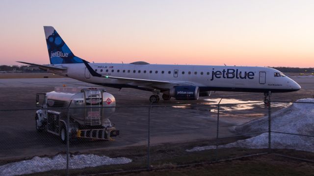 Embraer ERJ-190 (N183JB) - JetBlue E190 turns into Atlantic Aviation parking area at sunset at KSBN.