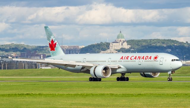 Boeing 777-200 (C-FIVX) - This Air Canada 777 slows on runway 24R at Montreal after the voyage from Paris