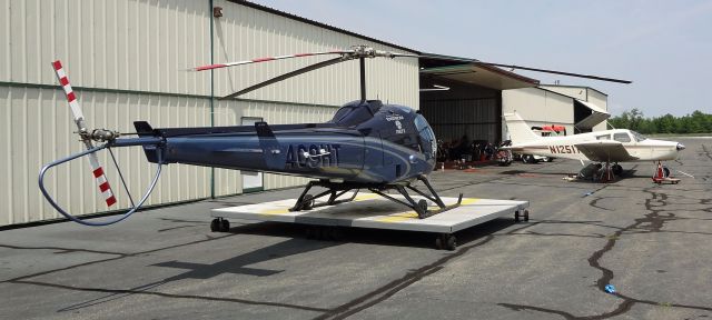 Enstrom 280 Shark (N409HT) - LINDEN AIRPORT-LINDEN, NEW JERSEY, USA-JUNE 20, 2023: Seen by RF in front of its hangar was this Enstrom 280FX helicopter. One of the first pictures of N409HT.