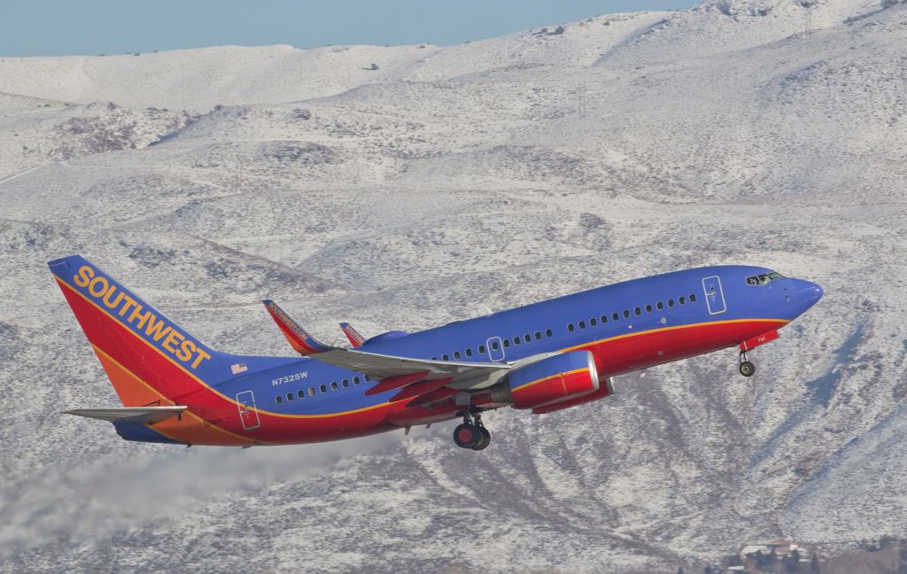 Boeing 737-700 (N732SW) - Climbing away from 16R past the Virginia Range mountains on a sunny but VERY cold New Years Eve afternoon departure.