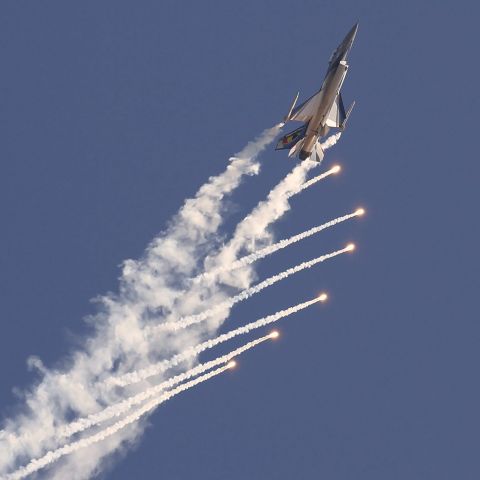 SFR84 — - [cn.6H-84]. Belgium Air Force General Dynamics [SABCA] F-16AM Fighting Falcon FA-84 defence flares deployed at the IWM Duxford EGSU Aerodrome UK.