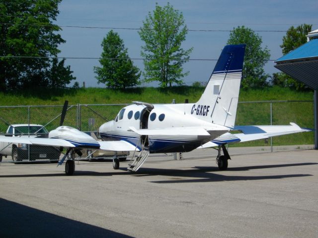 Cessna 421 (C-GXCF) - Parked at CYKF