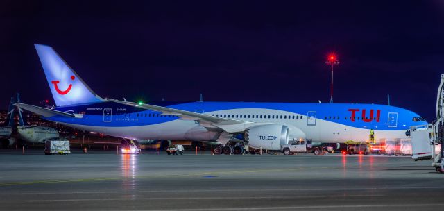 Boeing 787-8 (G-TUIN) - TUI (Thomson) Dreamliner arrived in YYC from Manchester as a cargo flight.  Shot from outside the perimeter of the cargo apron.