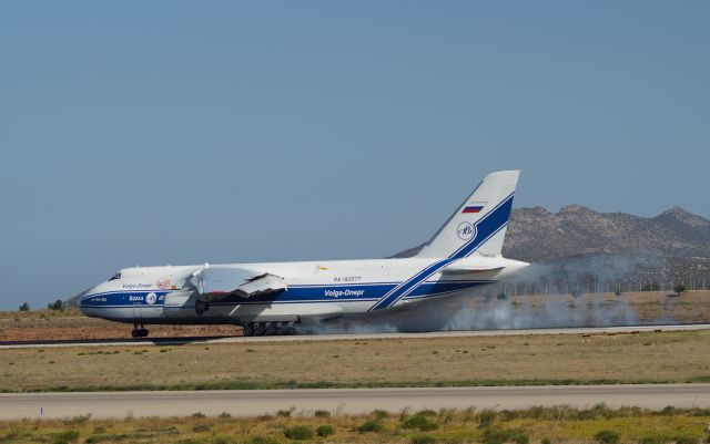 Antonov An-124 Ruslan (RA-82077) - Volga Dnepr An124 burns some rubber performing a firm landing in Athens Intl Airport runway 03R