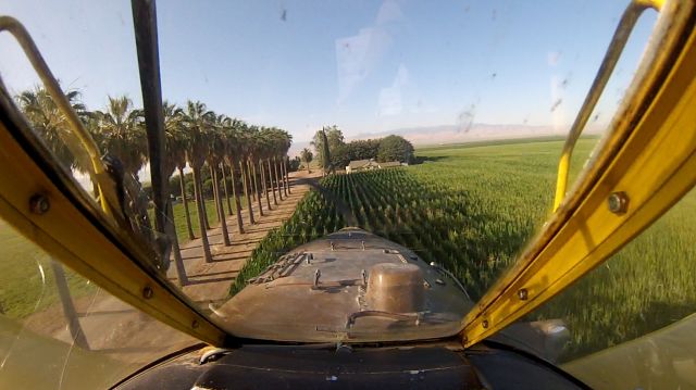 — — - AT 502 Spraying corn near Bakersfield CA.