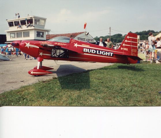 STEPHENS Akro (N10LL) - SUSSEX AIRPORT-SUSSEX, NEW JERSEY, USA-AUGUST 1991: Seen here at Sussex Airport during the world famous Sussex Airshow, is the late Leo Loudenslager Akro Laser 200 aerobatic aircraft. Leo won seven U.S. National Aerobatic titles and one World Aerobatic Championship. He died in a motorcycle accident in 1997. If his schedule permitted, Leo would perform every year at the airshow. This aircraft is now on display at the Smithsonian National Air and Space Museum in Chantilly, VA.