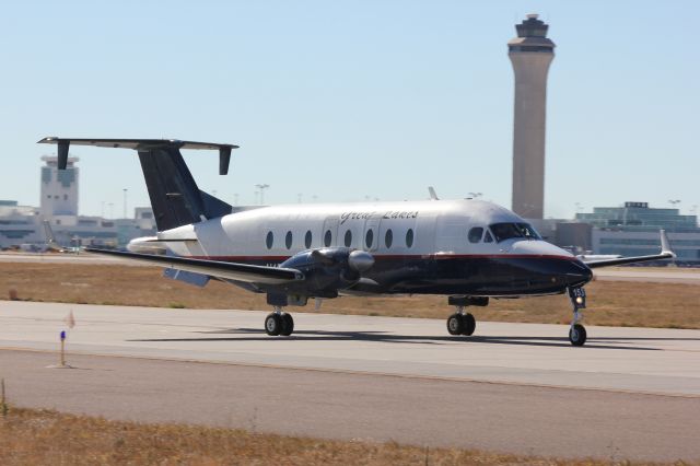 Beechcraft 1900 (N153GL) - Taxiing out to runway 8 for departure.