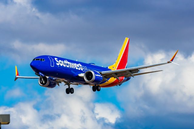 Boeing 737 MAX 8 (N8735L) - A Southwest Airlines 737 MAX 8 landing at PHX on 2/28/23. Taken with a Canon R7 and Canon EF 100-400 L ii.