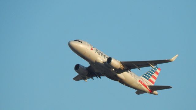 Airbus A319 (N9010R) - N9010R leaving for MMMY on a cool October evening.