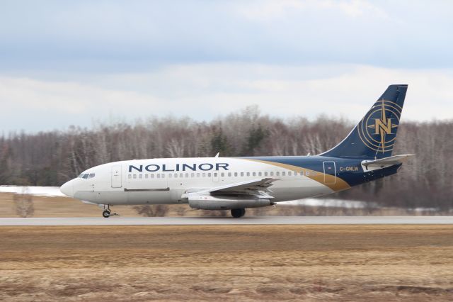 Boeing 737-700 (C-GNLW) - A Nolinor B-737-200 on take off roll at Lake Simcoe Regional Airport.