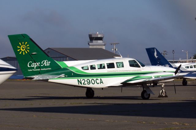 Cessna 402 (N290CA) - Cape Air's Green C402 rests in sunlight on the ramp at HYA on 7/19/20. 