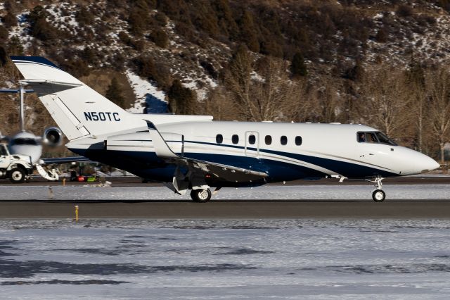 Hawker 800 (N50TC) - Hawker 800 landing at Aspen. Good illustration of the lift dump system: When lift dump is activated, the flaps are deployed to 75 degrees ad the spoilers are actuated. This helps the jet slow down immensely, so much so that many times I rarely touch the brakes until we're below 80kts.