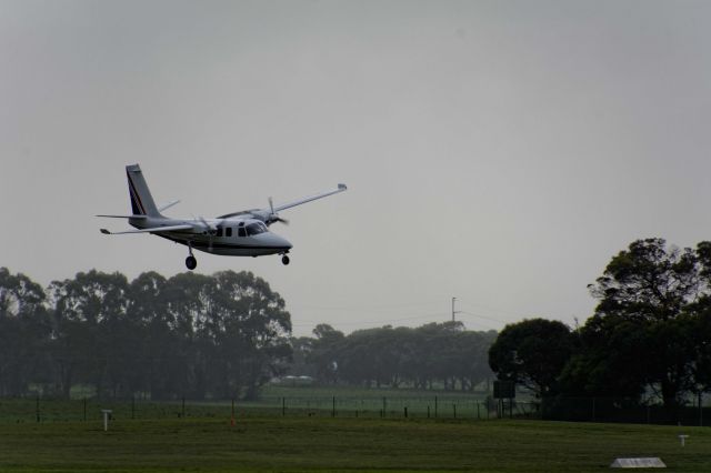 Aero Commander 500 (VH-YJL) - Never seen a plane land on this angle before!