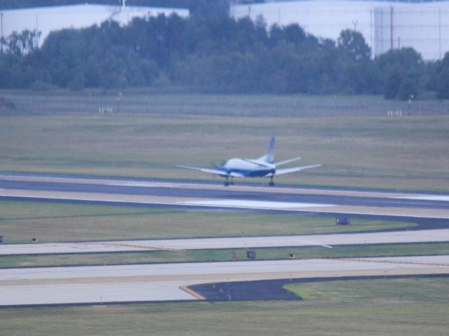 Saab 340 (N239CJ) - Landing on 01R at IAD on 8/7/2011 as seen from the Air & Space Museum Tower.