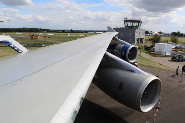 Boeing 747-400 (G-CIVB) - The port side wing of a preserved BA B747-400, wearing the Negus Livery (used between 1974-1978. br /br /Location: Cotswold Kemble Airport.br /Date: 31.08.22 (dd/mm/yy).