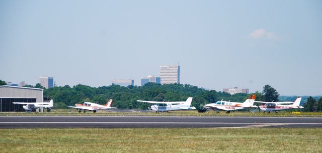 Beechcraft Baron (58) (N4375W) - Downtown Greenville skyline behind the airport.