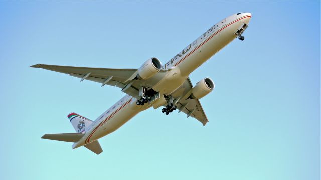 BOEING 777-300 (A6-ETM) - BOE263 climbs from runway 16R for a flight test on 1/15/13. (LN:1067 c/n 39688).