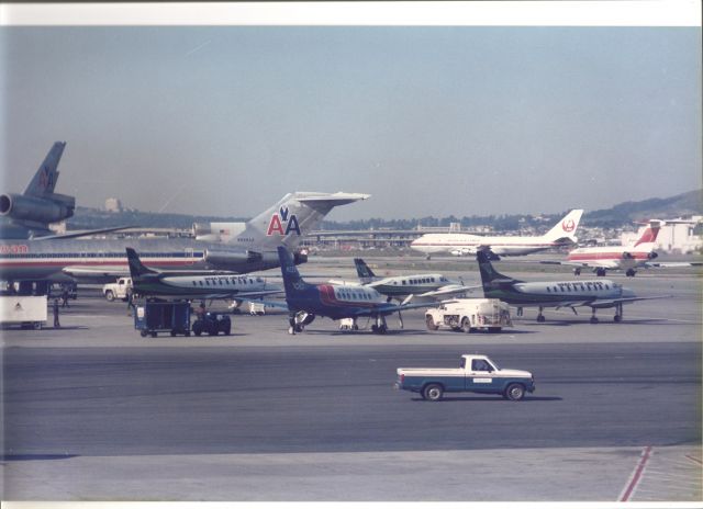 Boeing 727-100 (N889AA) - SFO - this picture taken from the old International terminal at SFO- now set to re-open in Feb 2014. This view looking north with Runway 10 operations in use this day, Date Apprx mid 1980s