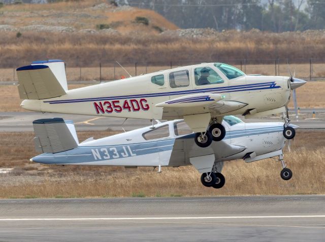 Beechcraft 35 Bonanza (N354DG) - Beech Beechcraft J35 (foreground) and V35A at Livermore Municipal Airport, Livermore CA. October 2020