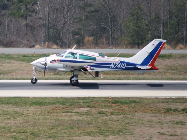 Cessna 310 (N741Q) - Arriving on runway 20 KJQF - 3/18/09