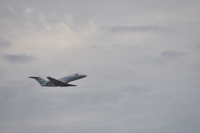 Cessna Citation CJ3 (N795JS) - Departing Naples, FL, 2/9/2022. Photo taken from adjacent town park