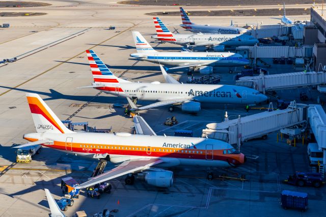 Airbus A319 (N742PS) - 6 American Airlines planes parked at PHX, including the PSA retro livery A319, N742PS, and the Piedmont retro livery A319, N744P. Taken with a Canon 850D and Tamron 70-200 G2 lens. 78 MP stitched panorama photo.