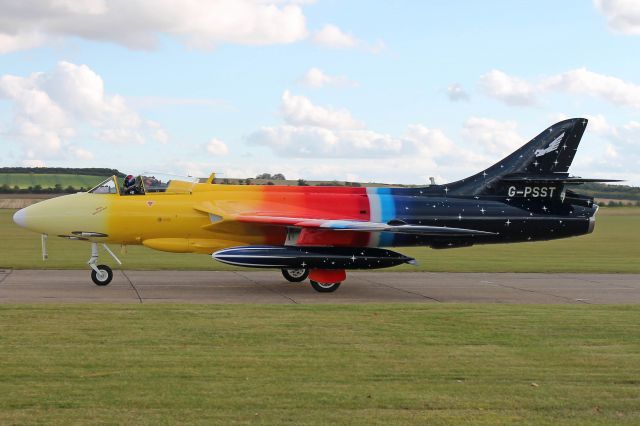 Hawker Hunter (G-PSST) - Jonathon “Flapjack” Whaley in the colorful “Miss Demeanour”, a 1956 Hawker Hunter, taxiing to park after rehearsing before the Duxford Imperial War Museum Autumn Air Show on 12 Oct 2012.