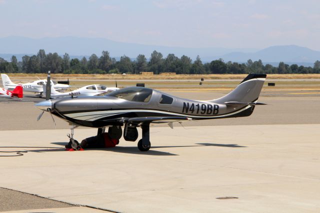 Lancair Legacy 2000 (N419BB) - KRDD - 2012 BRYAN J BURR LANCAIR LEGACY-Fixed wing single engine. The Redding Air ramp crews were checking the tire on the starboard side - unsure why.