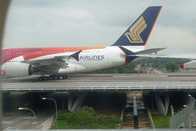 Airbus A380-800 (9V-SKJ) - 9th August 2015: Taxiing at Changi airport, another A380 in special livery heading for the runway to start.