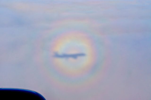 Boeing 757-200 — - Circular rainbows are awesome!  In all of my flying through the years, I've seen only a hand full of circular rainbows.  I witnessed this one on January 22, 2014, while flying from KSLC to KDTW.  This one was particularly awesome because of the shadow of the aircraft in the middle of the rainbow.  I was blessed to see this rare site.