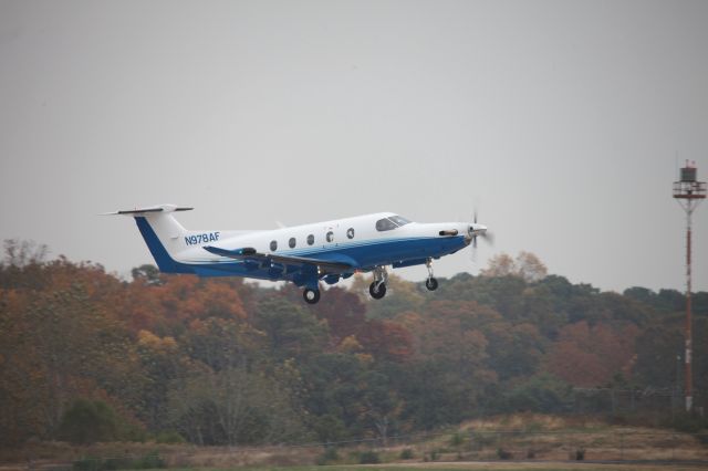 Pilatus PC-12 (N978AF) - Fall color at KPDK as N978AF departs on 02R