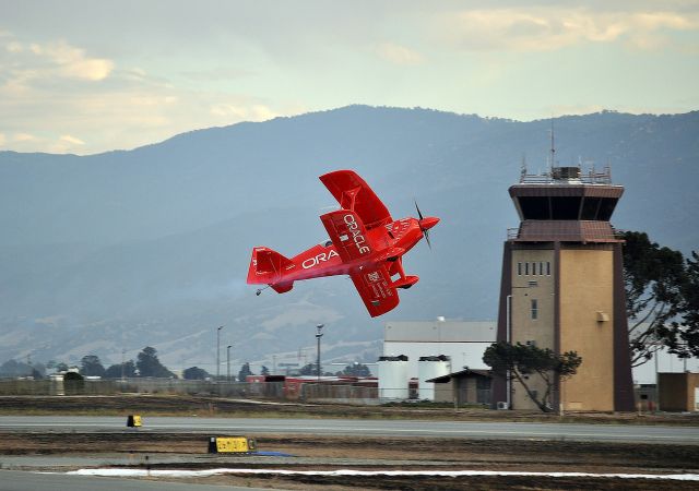 Experimental 100kts-200kts (N260HP) - 2011 Salinas International Airshow. Sean D. Tucker's Oracle Challenger III in front of the Salinas tower.