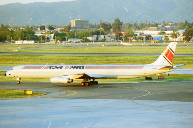 McDonnell Douglas DC-8-60 (N818AX) - KSJC - early.mid 1990s before SJIA officials screwed up the airport, blocking this view from the parking structure -with the then new Intl Terminal- Airborne Express DC-8-63"LD" rolling to Cargo ramp by the old San Jose Tower - this back when SJC would or could have as many as 5 DC-8 Cargos on the ramp and north cargo ramp also. This jet delv new to KLM in August 1969, then IcelandAir flew this jet 1985, until Hawaiian Airlines took this for airliner service in 1990. Airborne Express then converted this jet to cargo in 1993 and seen here at San Jose on the early AM freighter arrivals at about 06:45am. CN: 46075 LN: 484  I have a few videos from the same time period of DC-8s at San Jose,CA search Youtube: MarsAveSo