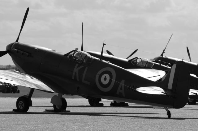 — — - Supermarine Spitfires on the flightline at Duxford Air Museum.
