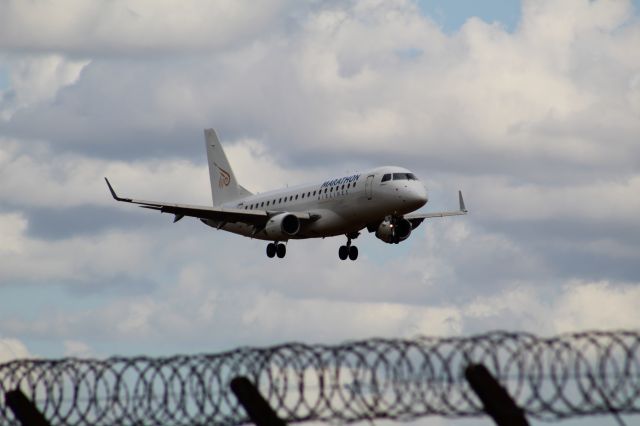 Embraer 175 (SX-ASK) - A Marathon Airlines E175 (operating for Flybe at the time) on final approach into LHR, landing on runway 27R.br /br /Location: Northern Perimiter Road, beside Runway 27R.br /Date: 26.08.22 (dd/mm/yy).