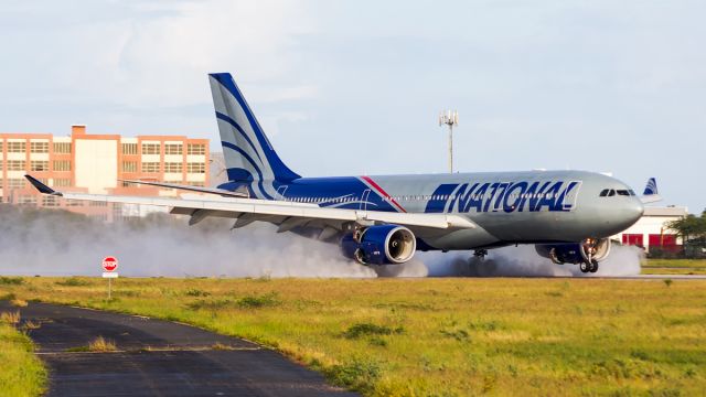 Airbus A330-200 (N819CA) - A very rare and special arrival from Ushuaia Argentina. Wet runway action. Splash...