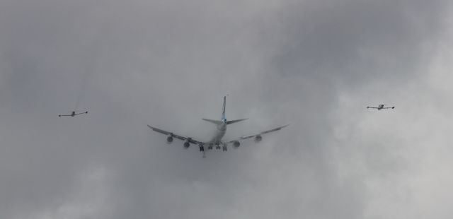 BOEING 747-8 (N747EX) - Boeing 747-8 about to disappear into the Seattle clouds on its maiden flight with two Boeing T33 chase planes.