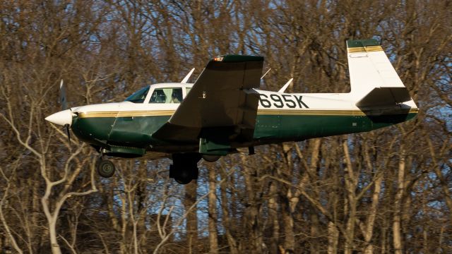 Mooney M-20 (N5695K) - N5695K doing a low visual approach onto College Park Airport's runway 33 