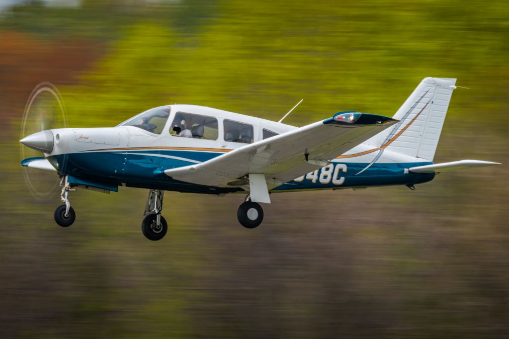 Piper Cherokee Arrow (N6948C) - Panning shot of Piper PA-28R-201 N6948C taking off from KLOM (Wings Field).br /br /1/60 sec. f/20 500mm ISO 160