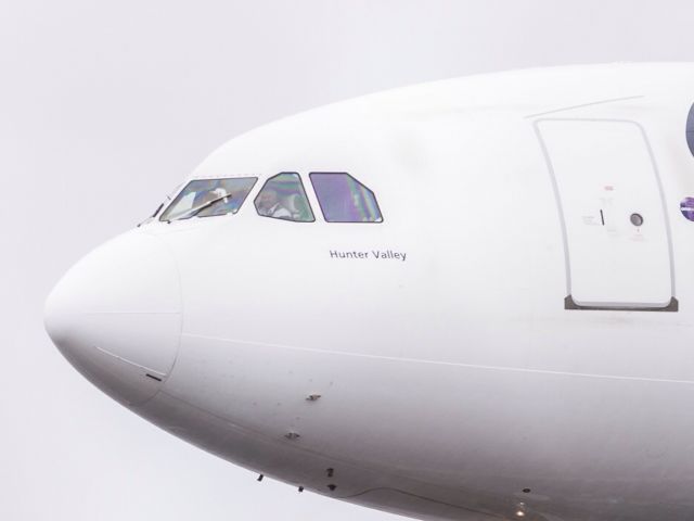 Airbus A330-300 (VH-EBH) - Captain Phil waving to us after vacating A5 very bad weather at Sydney