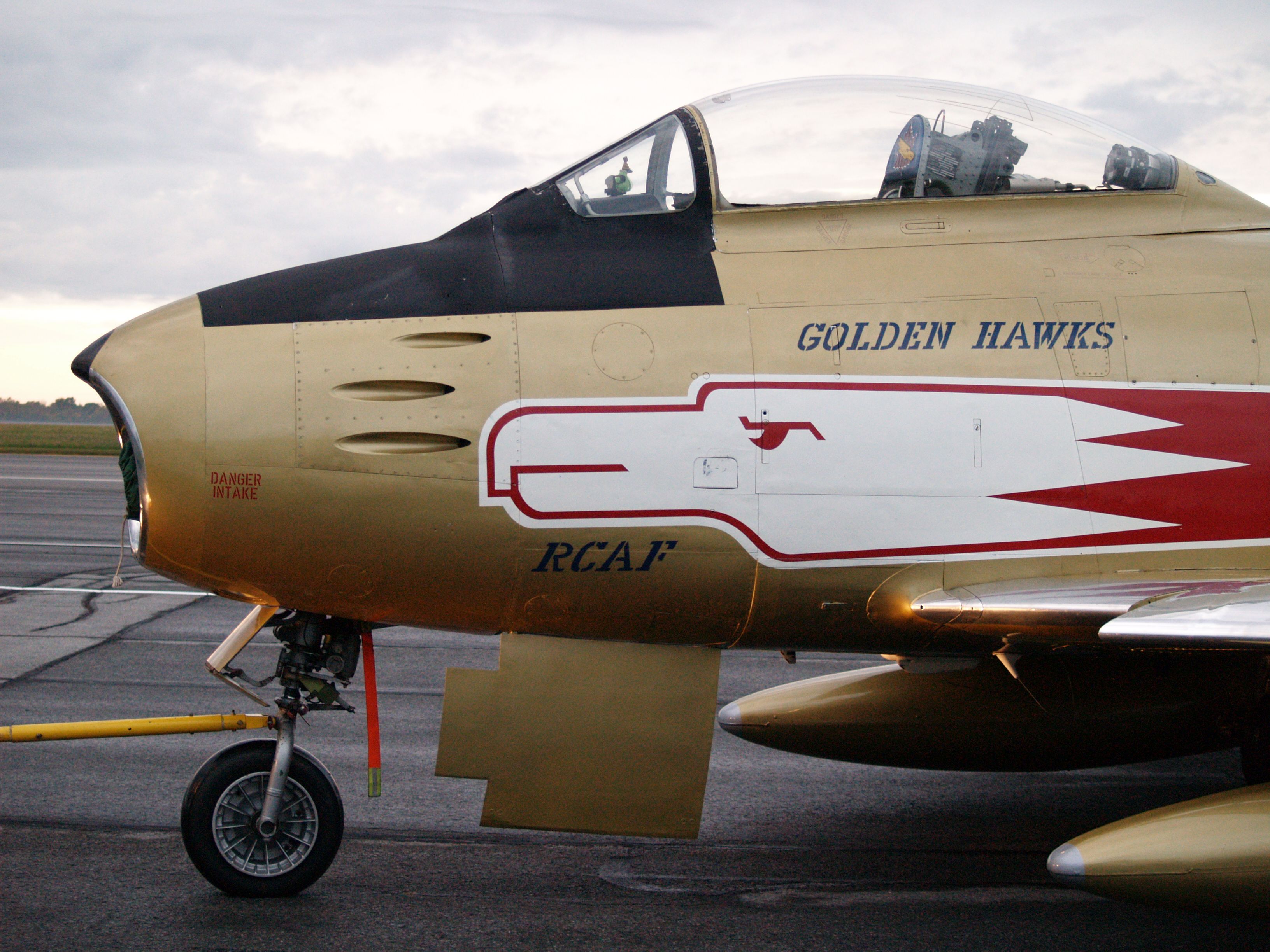 North American F-86 Sabre (C-GSBR) - An F-86 Sabre Jet in Golden Hawks livery makes a stop in Kingston during its tour of Canada in 2009 (Oct 4).  This shot taken in the dawn light as the aircraft was towed out for static display.