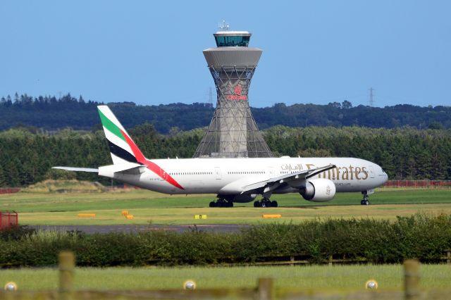 BOEING 777-300 (A6-EPQ) - Emirates B777-300H(ER) (A6-EPQ) taxiing to takeoff at 14.46 Hrs in front of NCL "new" tower. (Photo 19 Aug 23)