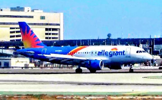 Airbus A319 (N335NV) - I would prefer to see an Allegiant A320, but this works out. Allegiant A319 in the new livery after touchdown.