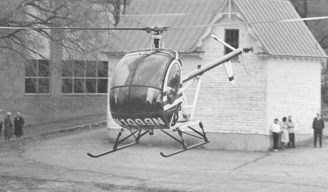 N1099N — - 1980 Hughes 269C in 1993 taking off from a downtown parking lot in Danville Va.