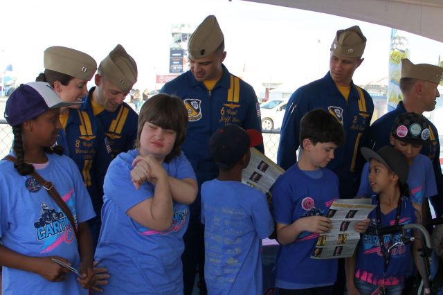 — — - Dont know if this appropriate without the aircraft, but The Blue Angel team always vists the  special needs kids after their practice flight the day before the show. March 18th 2016, Captain Jeff Kuss autographing one of the kids T-Shirts along with other team members.He leaves special kids with special memories of the day.